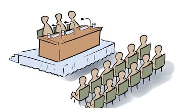 Publikum und Panel bei einer Tagung