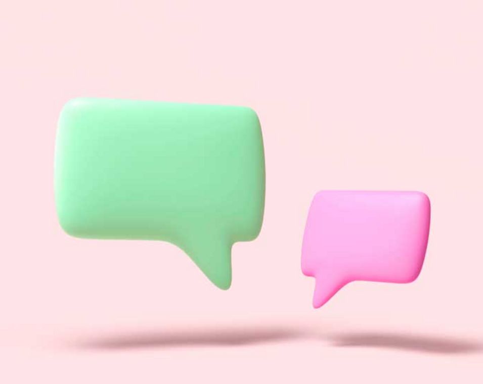 Symbolbild Dialog: Grüne und pinke Sprechblase vor rosa Hintergrund