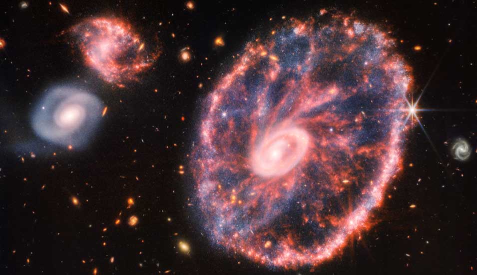 Das Bild zeigt die sogenannte "Cartwheel"-Galaxie und ihre Nachbargalaxien.