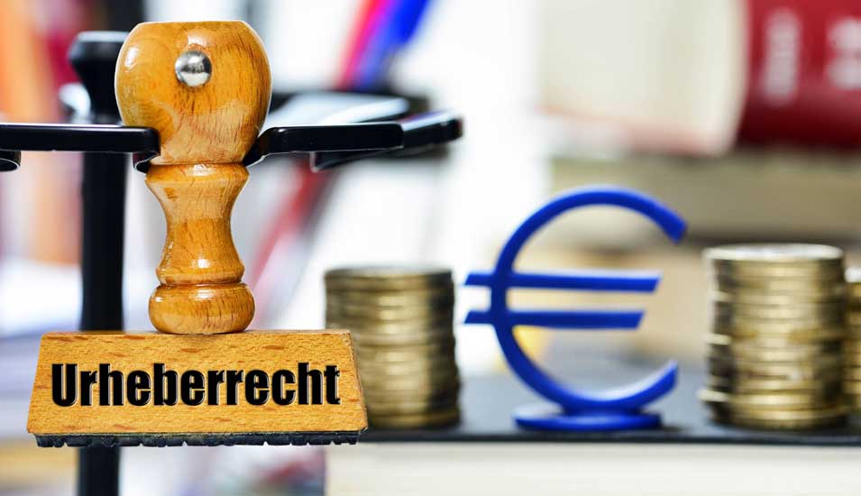 Das Foto zeigt einen Stempel mit dem Aufdruck Urheberrecht und ein Eurozeichen
